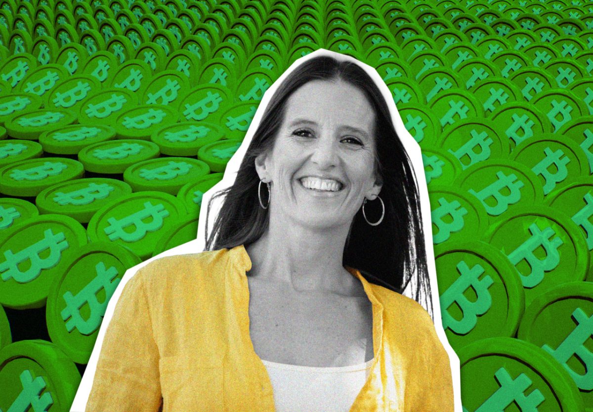 Bitcoin symbol on a smartphone screen with a paycheck in the background
