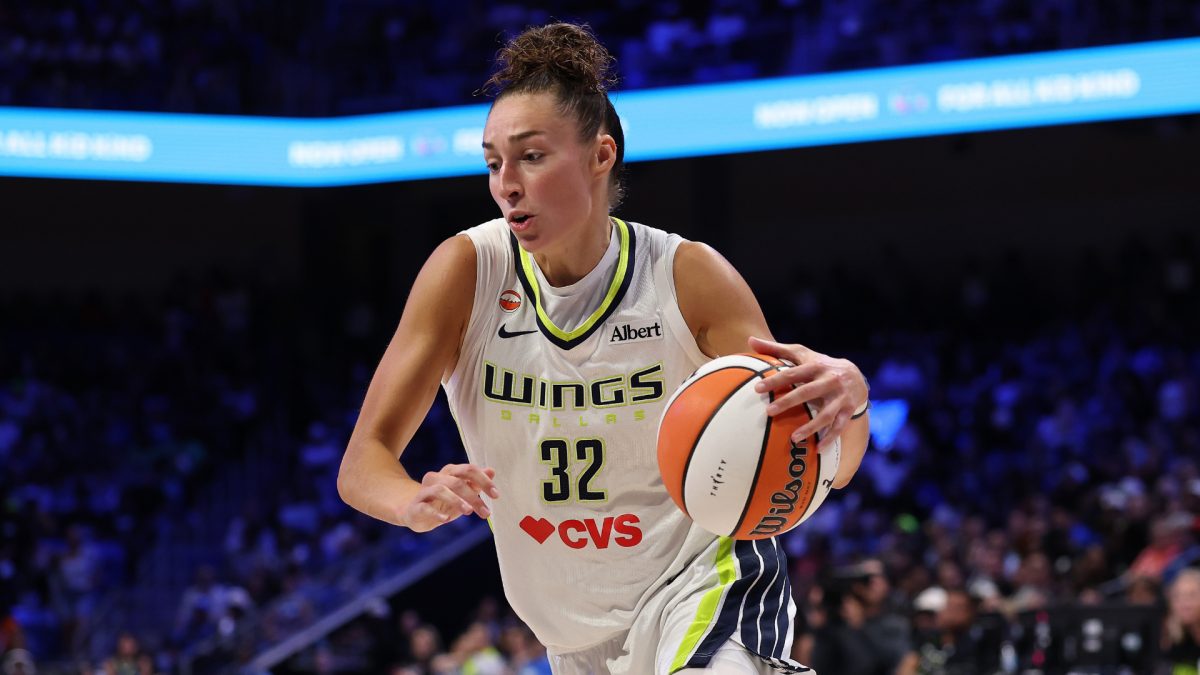 Jessica Shepard of the Dallas Wings shoots over a defender during a 2026 game