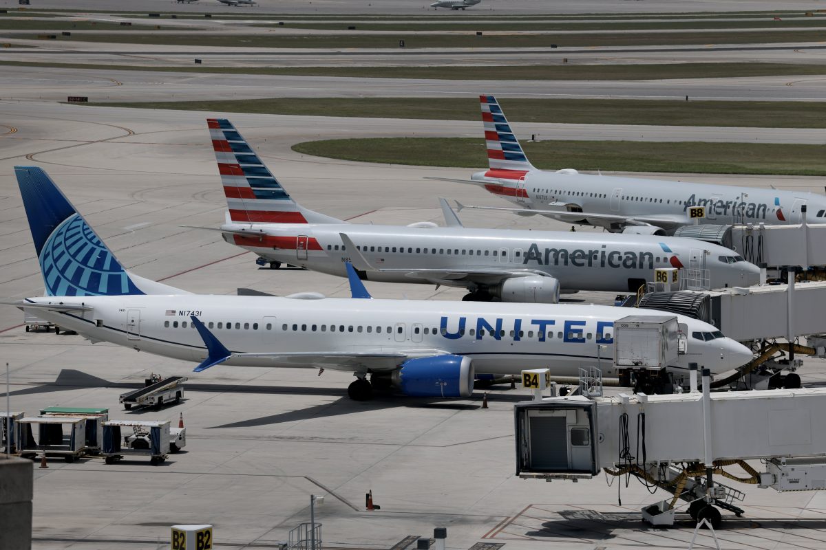 United Airlines passenger jet on runway with loyalty program branding
