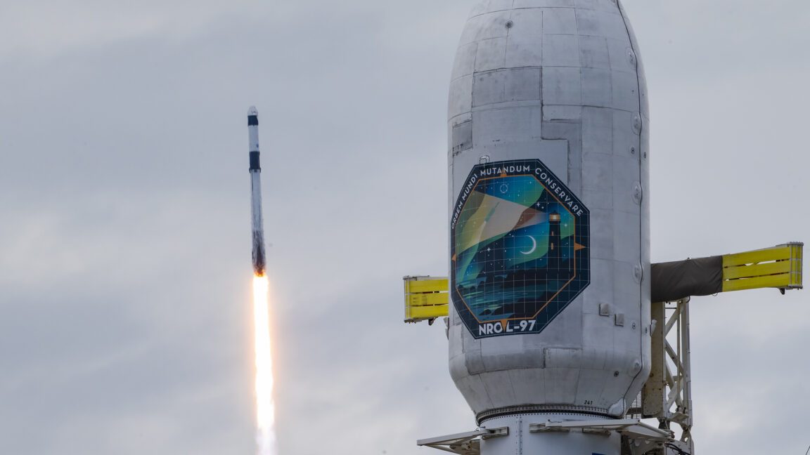 SpaceX Falcon 9 rocket lifts off from a coastal launch pad at dusk