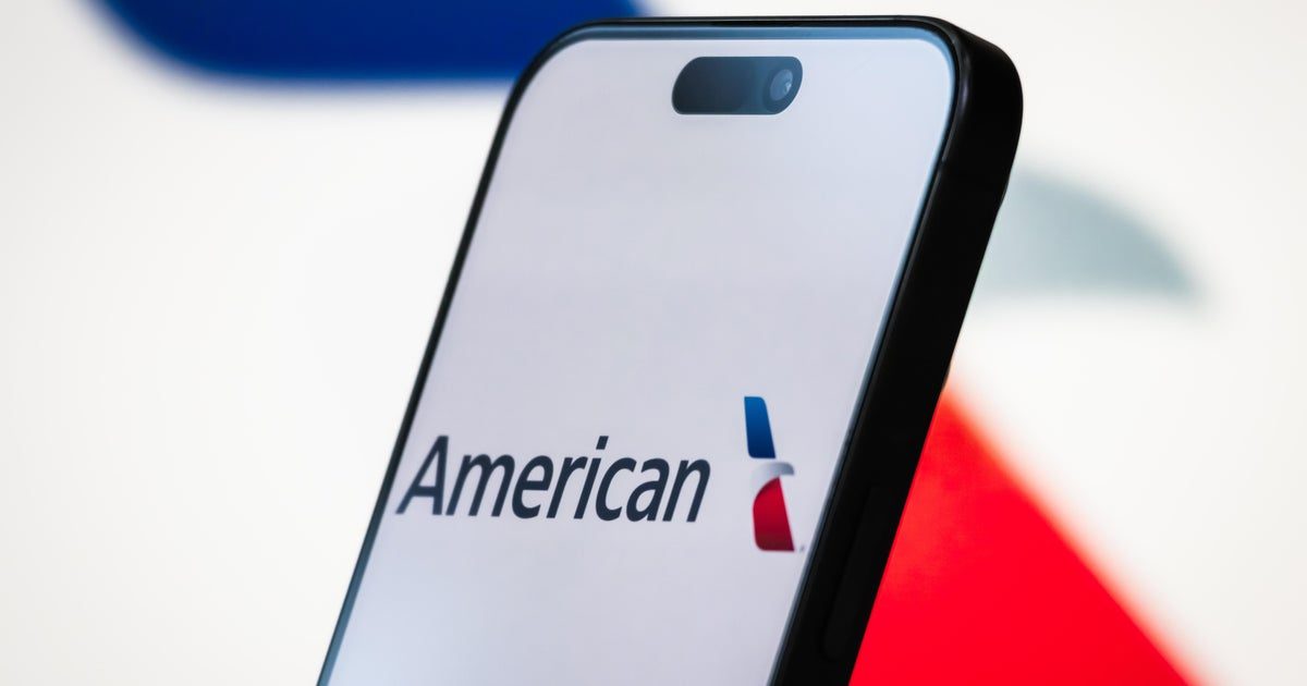 American Airlines jet on tarmac with passengers boarding