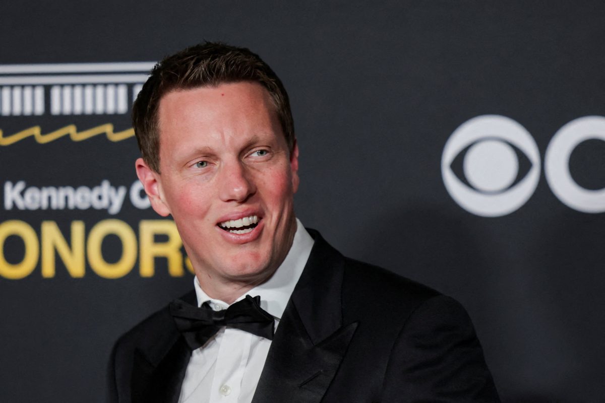 David Ellison speaking at a corporate event announcing the Paramount Warner Bros Discovery merger
