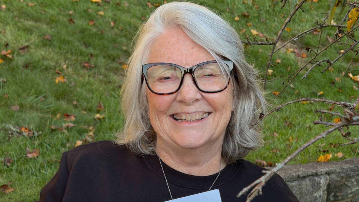Ellen Allen holding a letter from President Trump explaining a $500 health payment
