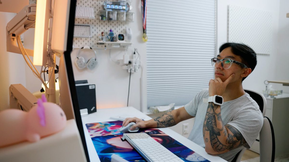 Retail investor at home reviewing stock trading platform showing Tesla margin position