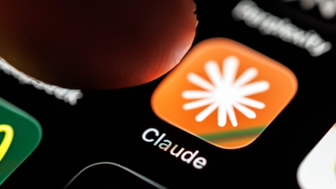 Anthropic logo displayed on a smartphone screen with a chat interface visible